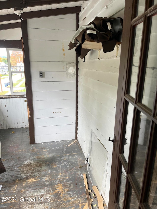 garage featuring wood walls