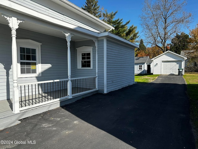 view of property exterior with an outbuilding and a garage