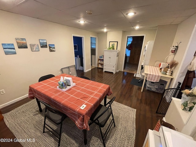 dining area with dark hardwood / wood-style flooring