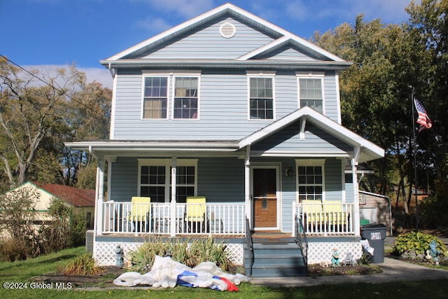 view of front of property featuring covered porch