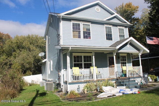 view of front of property with a front lawn and covered porch