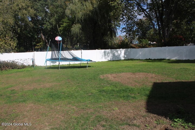 view of yard featuring a trampoline