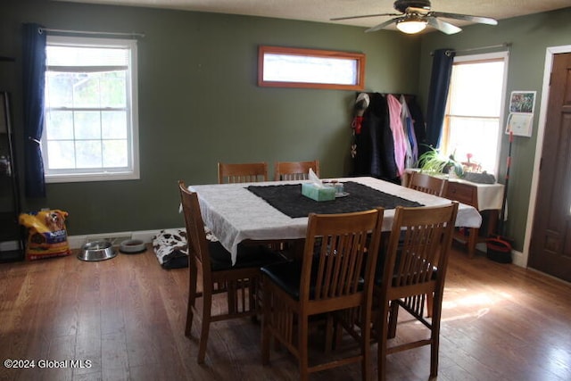 dining room featuring wood-type flooring and ceiling fan