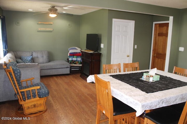 dining space featuring hardwood / wood-style floors and ceiling fan