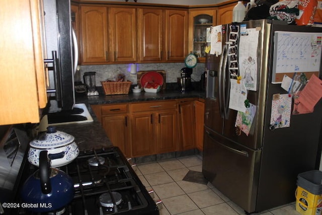 kitchen with light tile patterned flooring and stainless steel fridge with ice dispenser