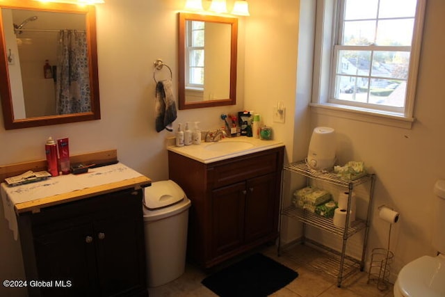 bathroom featuring vanity, tile patterned flooring, toilet, and a shower with shower curtain