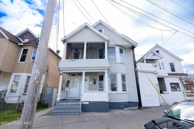 view of front of house with a balcony and a porch