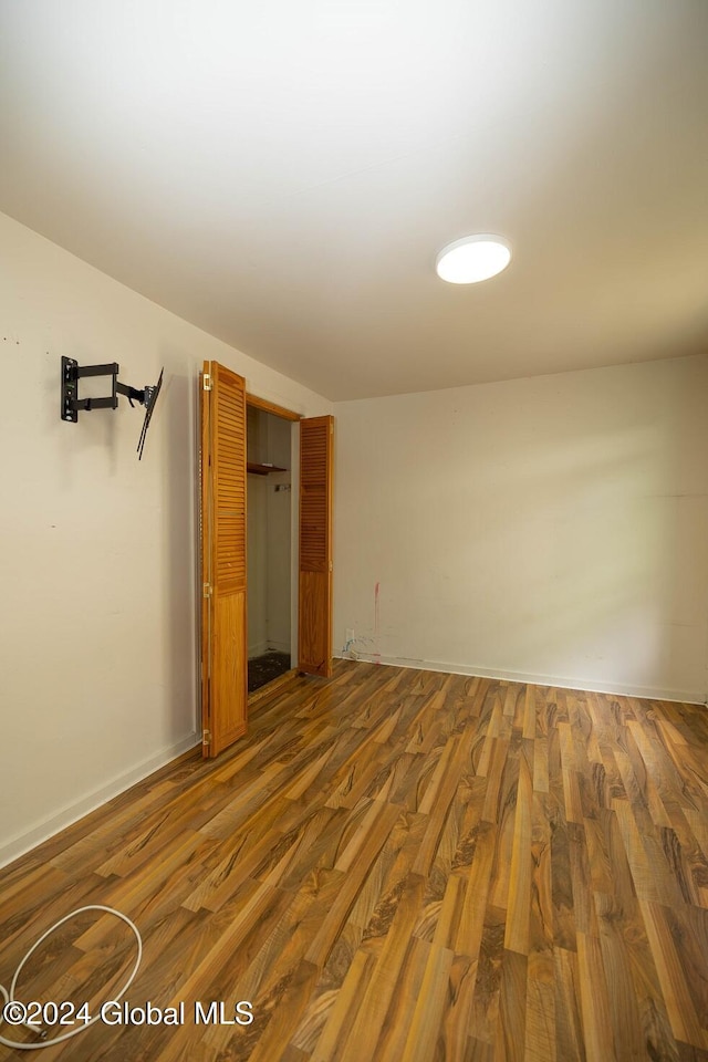 unfurnished bedroom featuring hardwood / wood-style floors