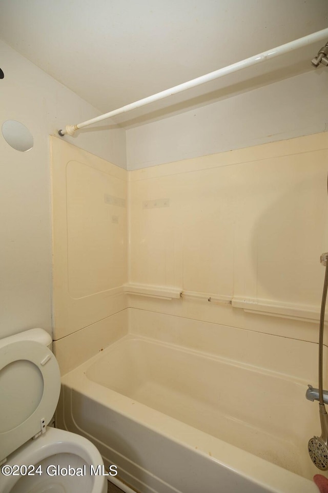 bathroom with toilet and shower / bathtub combination