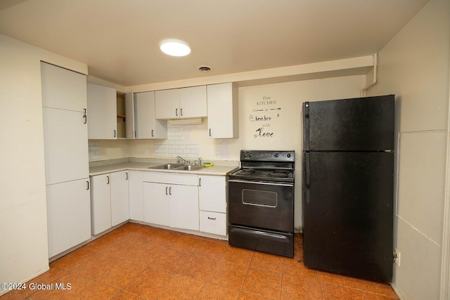 kitchen with black appliances, sink, decorative backsplash, and white cabinets