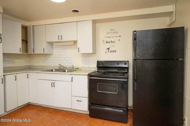 kitchen featuring sink, black appliances, white cabinetry, and backsplash