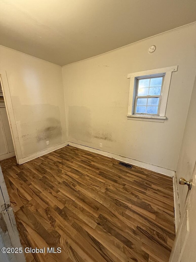 spare room with dark hardwood / wood-style floors