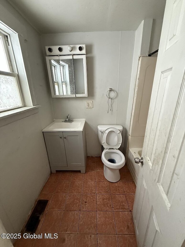 full bathroom featuring tile patterned floors, vanity, toilet, and shower / bathing tub combination