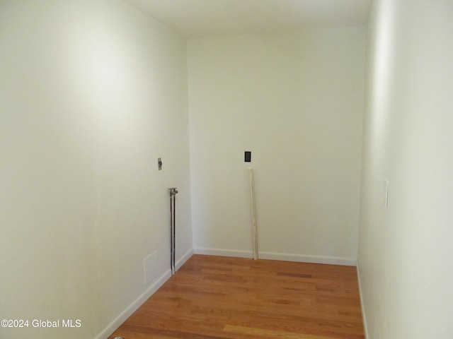 laundry area featuring light hardwood / wood-style flooring