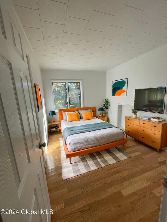 bedroom with light hardwood / wood-style flooring