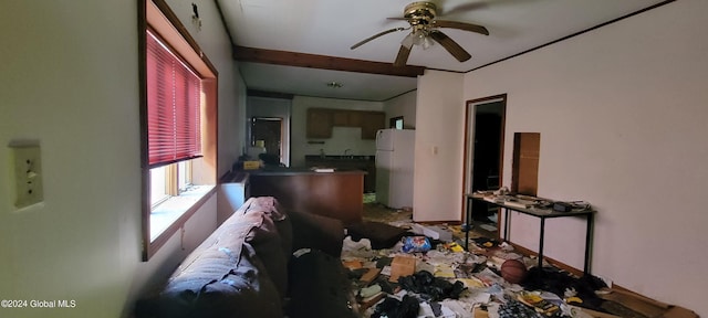 interior space featuring beam ceiling, white fridge, sink, and ceiling fan