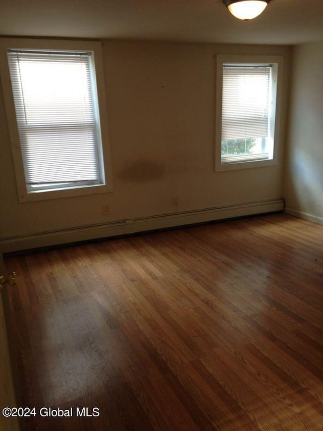 empty room featuring dark hardwood / wood-style flooring