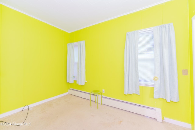 unfurnished room featuring a baseboard radiator, crown molding, and carpet