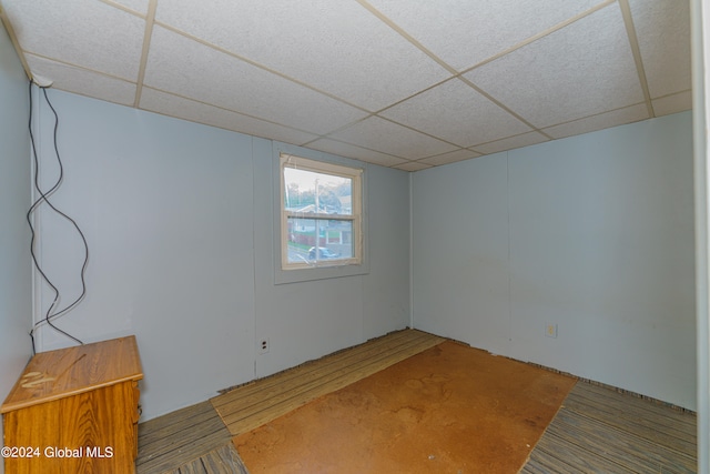 basement featuring a paneled ceiling