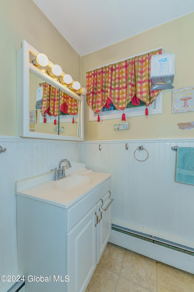 bathroom featuring baseboard heating, vanity, and tile patterned floors