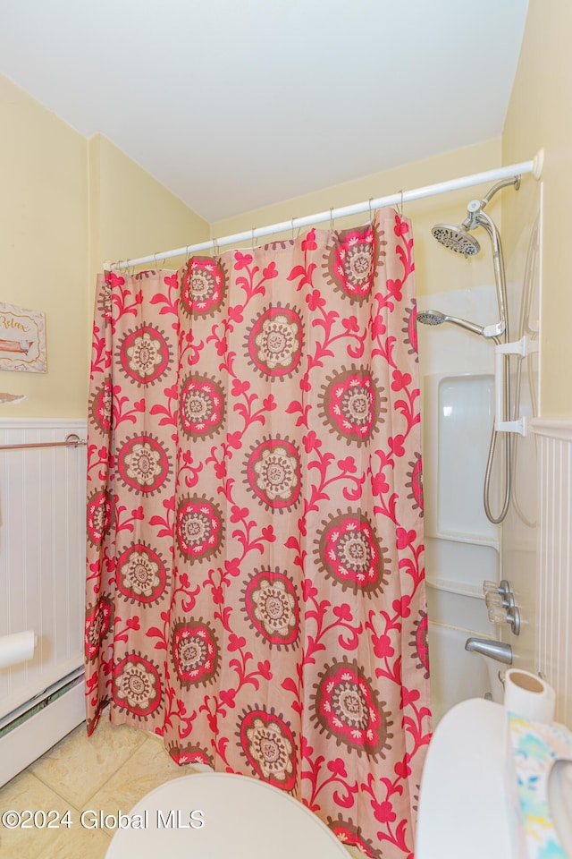 bathroom featuring toilet, walk in shower, baseboard heating, and tile patterned flooring