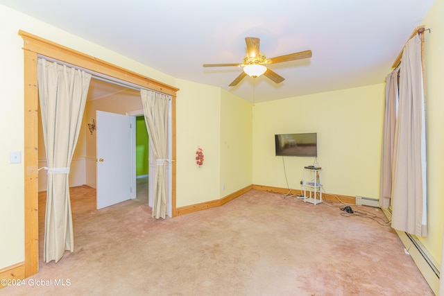 unfurnished living room featuring light carpet, a baseboard heating unit, and ceiling fan