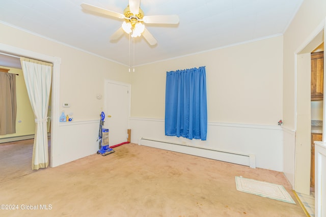 unfurnished room featuring ornamental molding, a baseboard heating unit, carpet, and ceiling fan