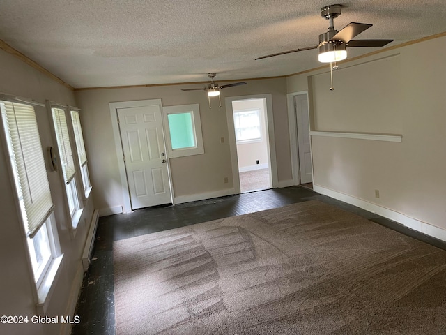 foyer entrance featuring ornamental molding, a textured ceiling, and ceiling fan