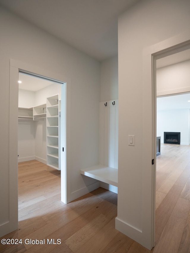 mudroom with light hardwood / wood-style flooring