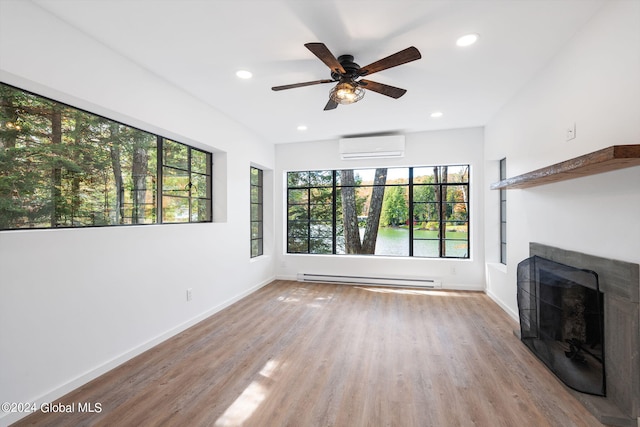 unfurnished living room featuring light wood-type flooring, plenty of natural light, and ceiling fan