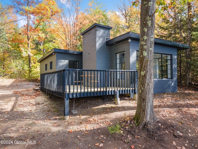 back of property featuring a wooden deck