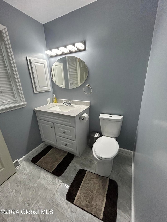 bathroom with vanity and toilet