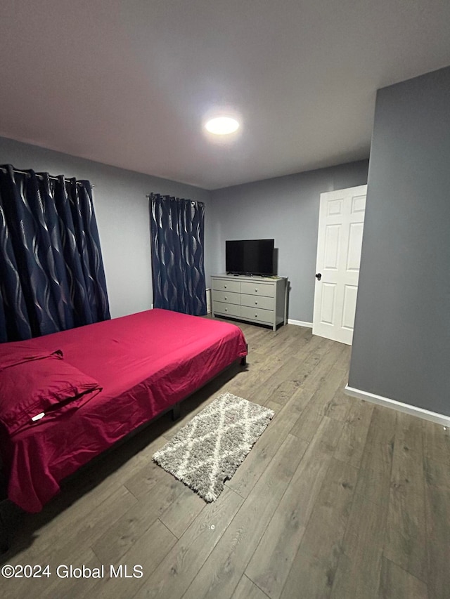 bedroom featuring hardwood / wood-style flooring