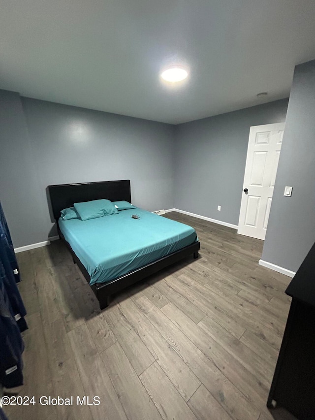 bedroom featuring hardwood / wood-style flooring