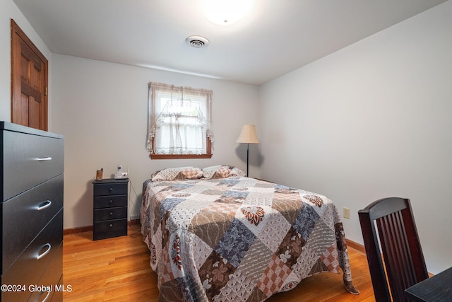 bedroom with light hardwood / wood-style floors