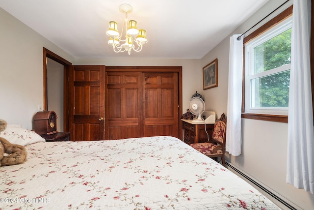 bedroom with a notable chandelier and a baseboard heating unit