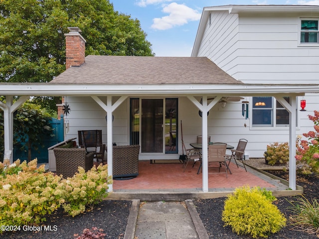 rear view of property featuring a patio area