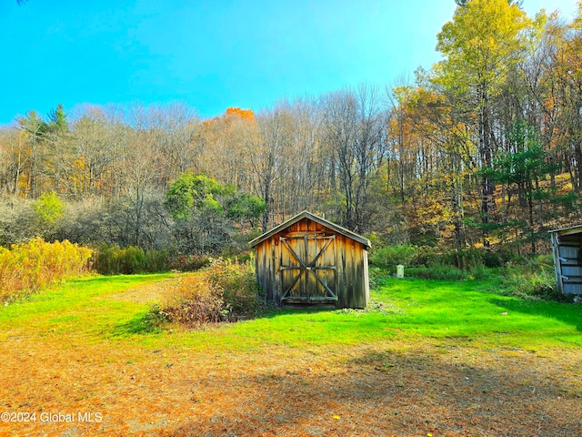 view of outbuilding with a lawn