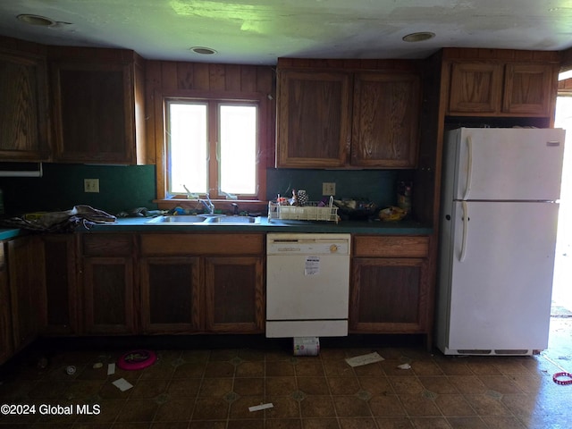 kitchen featuring sink and white appliances