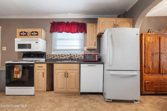 kitchen featuring light brown cabinets, light tile patterned flooring, crown molding, sink, and white appliances