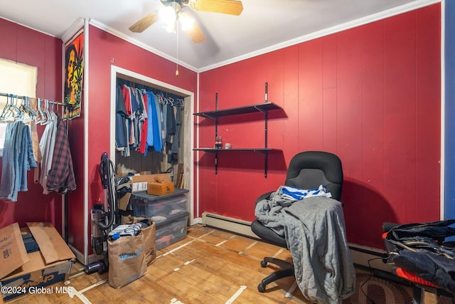 bedroom with a closet, ornamental molding, light wood-type flooring, a baseboard radiator, and ceiling fan