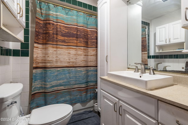 bathroom with backsplash, walk in shower, tile walls, toilet, and vanity