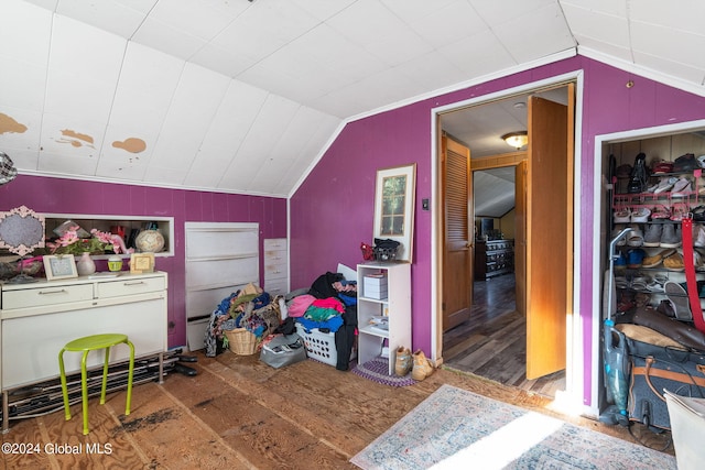 interior space with lofted ceiling and hardwood / wood-style floors