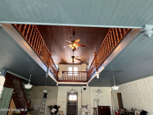 interior space featuring ceiling fan, high vaulted ceiling, and wooden ceiling