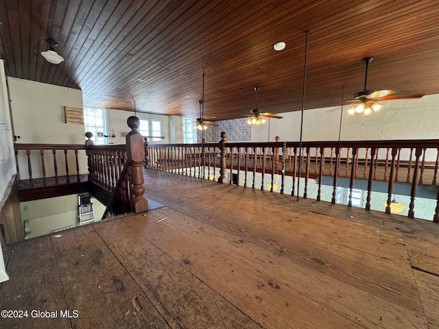 hallway with hardwood / wood-style floors, wooden ceiling, and vaulted ceiling