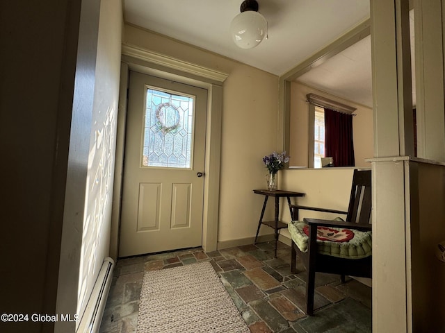 entrance foyer featuring a wealth of natural light and baseboard heating