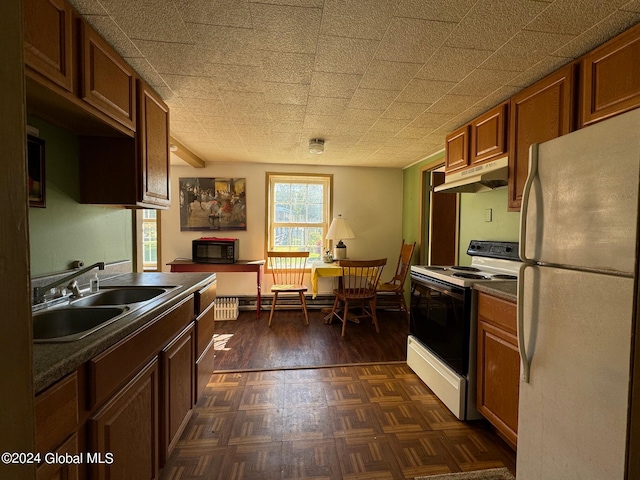 kitchen featuring sink, white appliances, and dark hardwood / wood-style flooring