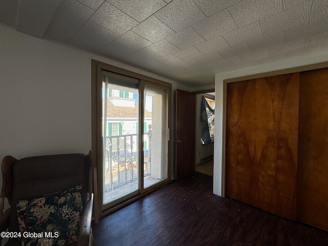 doorway with dark hardwood / wood-style floors