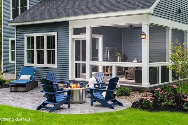 43 Huna Way Lot 10, Lake George, NY 12845 - rear view of house featuring an outdoor fire pit, a shingled roof, a patio, and a sunroom