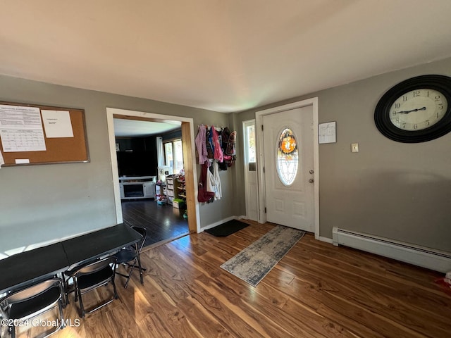 entrance foyer with dark wood-type flooring and a baseboard radiator